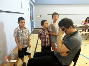 They took turns to tell the grandmaster their move.